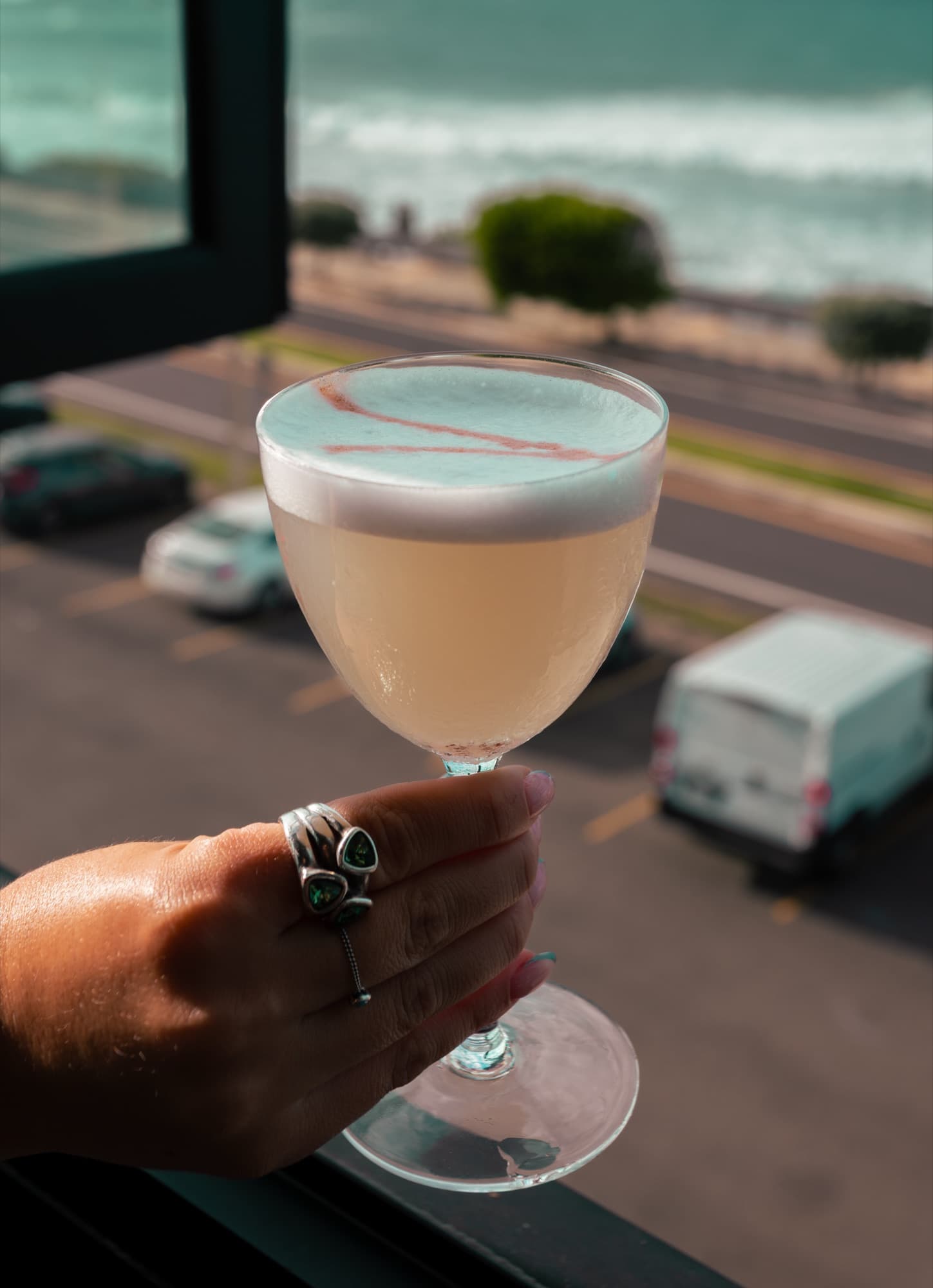 Cocktail held up against the street