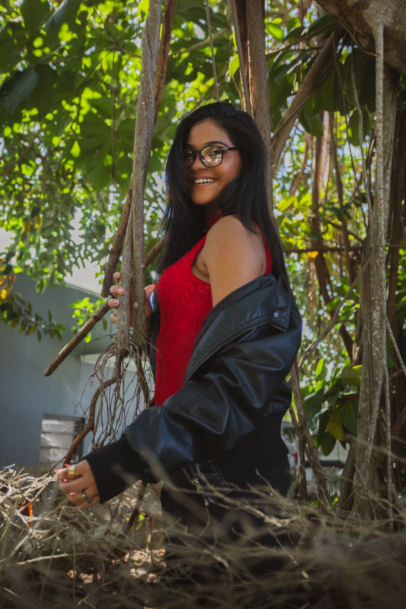 Portrait framed by out-of-focus branches