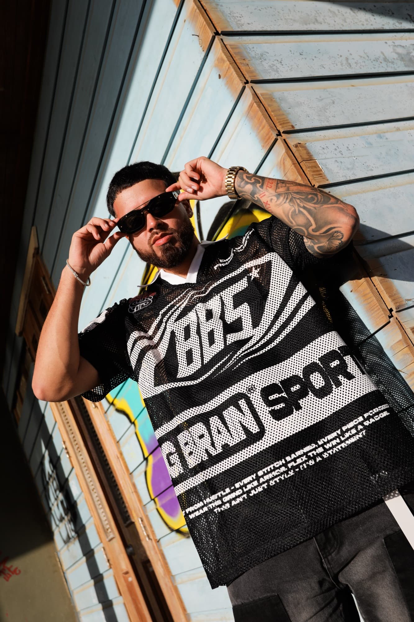 Kev123 in a jersey beneath a palm tree